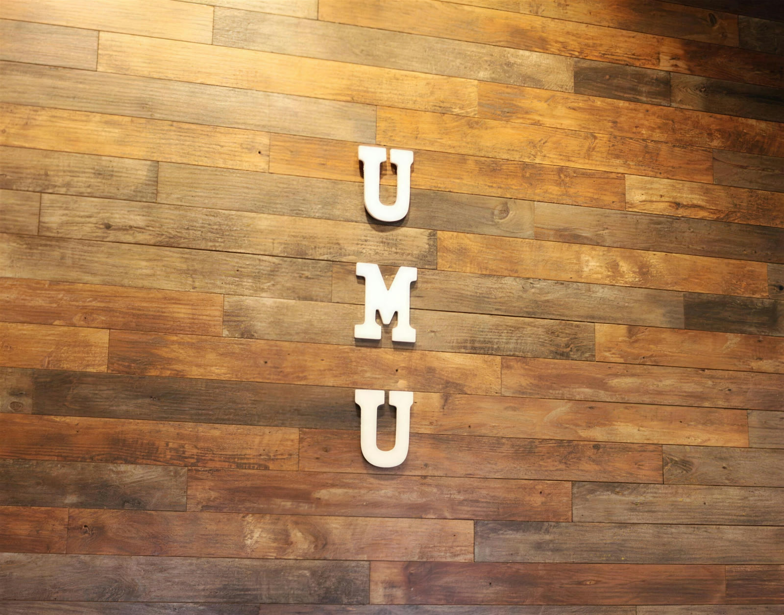 UMU letters on the wood wall