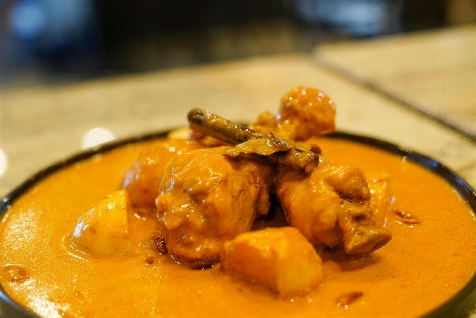 Thai chicken curry with potatoes in coconut sauce